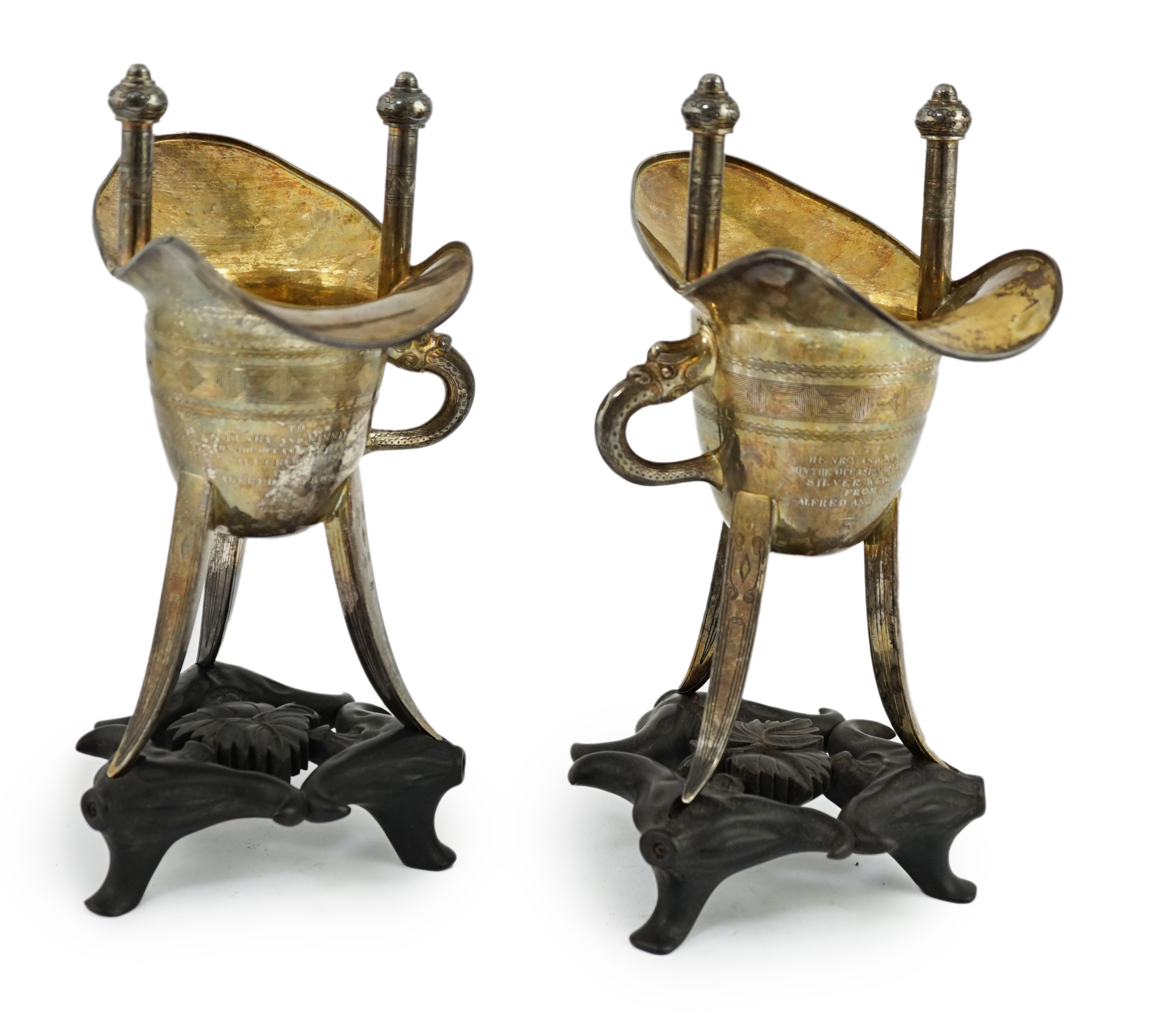 A pair of early 20th century Chinese archaistic silver 'Jue' wine cups, by Wang Hing, Hong Kong